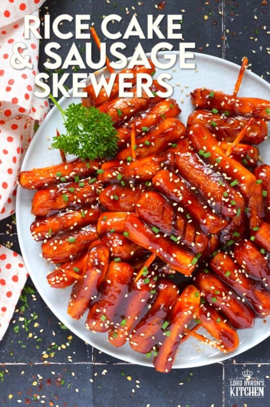 A popular Korean snack, tteok kkochi, are pan-fried rice cakes that become slightly crispy on the outside, yet retain that crave-worthy soft and chewy interior. Served on a wooden stick, these Rice Cake and Sausage Skewers are sweet and spicy and one of the best things I've eaten in a very long time! You simply have to try these! #ricecakes #sausage #skewers #korean #tteok