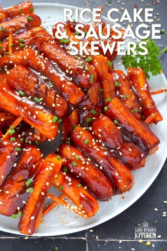 A popular Korean snack, tteok kkochi, are pan-fried rice cakes that become slightly crispy on the outside, yet retain that crave-worthy soft and chewy interior. Served on a wooden stick, these Rice Cake and Sausage Skewers are sweet and spicy and one of the best things I've eaten in a very long time! You simply have to try these! #ricecakes #sausage #skewers #korean #tteok