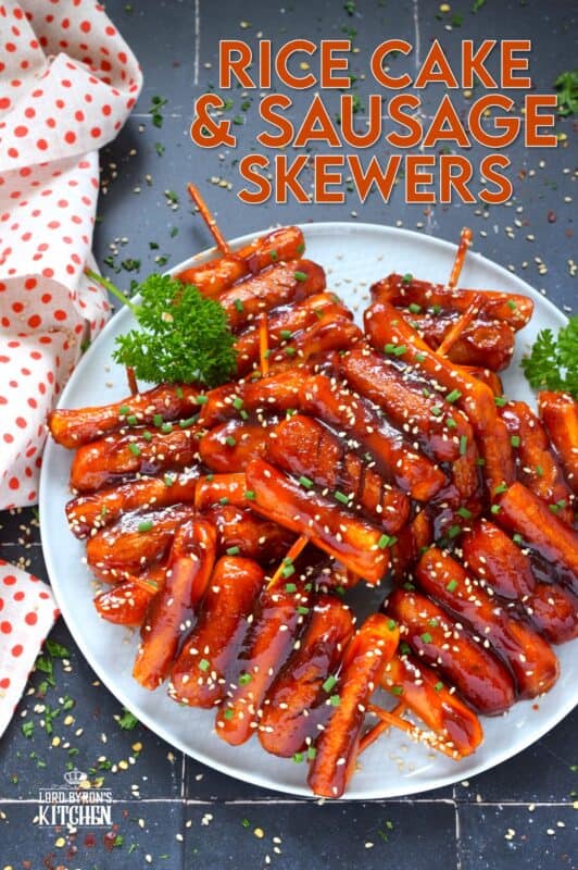 A popular Korean snack, tteok kkochi, are pan-fried rice cakes that become slightly crispy on the outside, yet retain that crave-worthy soft and chewy interior. Served on a wooden stick, these Rice Cake and Sausage Skewers are sweet and spicy and one of the best things I've eaten in a very long time! You simply have to try these! #ricecakes #sausage #skewers #korean #tteok
