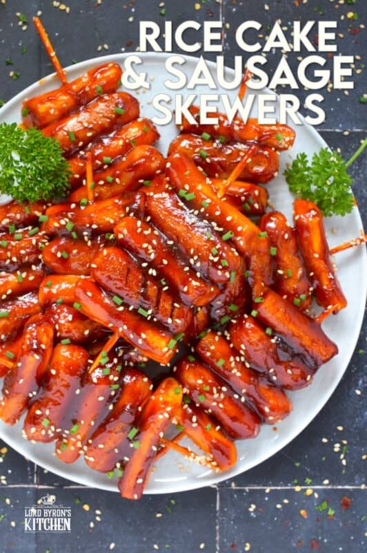 A popular Korean snack, tteok kkochi, are pan-fried rice cakes that become slightly crispy on the outside, yet retain that crave-worthy soft and chewy interior. Served on a wooden stick, these Rice Cake and Sausage Skewers are sweet and spicy and one of the best things I've eaten in a very long time! You simply have to try these! #ricecakes #sausage #skewers #korean #tteok