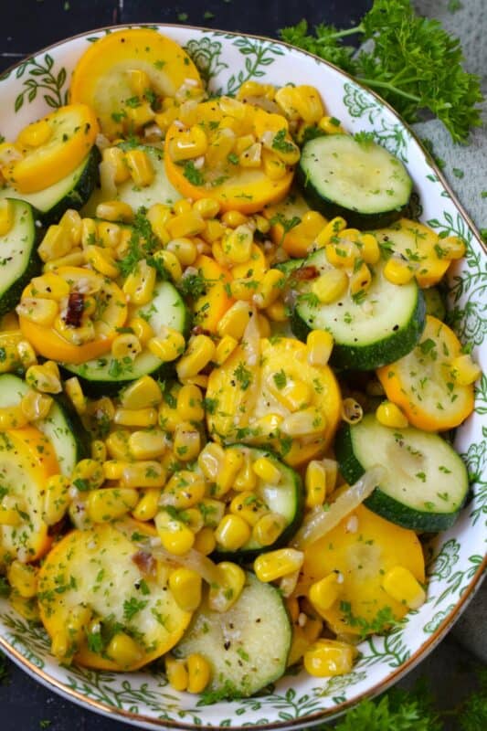 Utilize fresh summer produce for this Summer Squash and Corn side dish. Perfectly seasoned and prepared with aromatics like garlic and onion, this recipe is quick, easy, delicious, and budget-friendly too! #zucchini #courgette #squash #corn #side