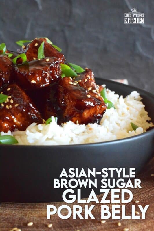 This sweet and sticky Glazed Pork Belly is cooked in two stages. First, the meat is boiled with seasonings and then fried before being cooked in a brown sugar, soy sauce, and rice wine reduction. Served with steamed rice, this is a meal that would please the toughest critic! #porkbelly #pork #belly