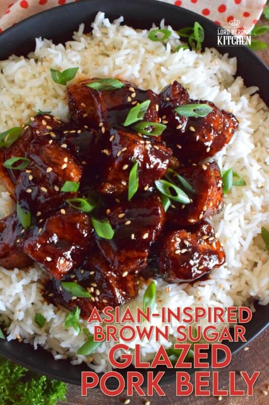 This sweet and sticky Glazed Pork Belly is cooked in two stages. First, the meat is boiled with seasonings and then fried before being cooked in a brown sugar, soy sauce, and rice wine reduction. Served with steamed rice, this is a meal that would please the toughest critic! #porkbelly #pork #belly