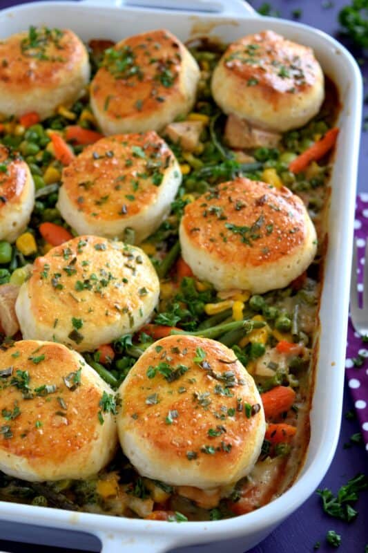 A home-style, family-favourite casserole was never this easy! Use leftover turkey and store-bought biscuits, canned condensed soup, and frozen veggies to prepare this hearty Leftover Turkey Casserole with Biscuits the whole family will love! #casserole #leftover #turkey #biscuits