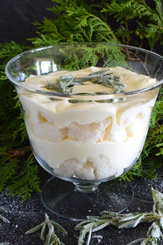 Everyone dreams of a white Christmas, or at least I do! If mother nature fails to deliver, one can always find comfort in a delicious, light, and fluffy dessert like this White Winter Trifle! Layers of angel food cake and homemade white chocolate whipped cream combine to make the most purely elegant treat! #trifle #winter #white #nobake #ganache #angelfood