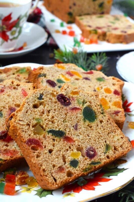 Serve this Holiday Fruitcake Loaf with a cup of hot tea at your year-end bookclub meeting, with your fellow card sharp at this week's cribbage game, or enjoy a slice alone in your living room with a good book on a lazy, snowy Sunday afternoon. Prepared with dried and candied fruit which has been soaked in strong tea, this loaf is moist and delicious! #fruitcake #christmas #loaf #bread #paradise