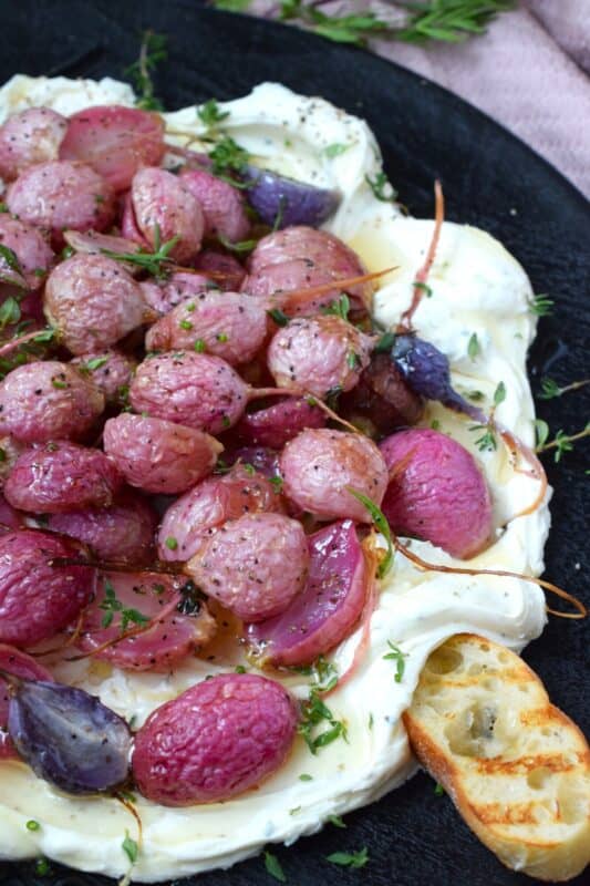 A beautifully delicious app or side, this Roasted Radish and Cream Cheese Appetizer recipe is quick and easy to prepare! The cream cheese spread is filled with fresh, robust flavour while the radishes are roasted until tender in a mild and simple salt and pepper seasoning. Drizzle with honey for a touch of sweetness! #appetizer #roasted #radish #honey #dip