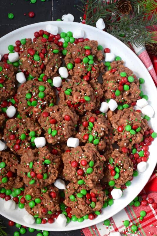 Time is short at Christmas with so many things to do, so incorporate some no-bake cookie options into your holiday baking to make your life easier. No Bake Avalanche Drop Cookies are prepared with chocolate, peanut butter, marshmallows, cereal, and candy. They are quick, easy, budget-friendly, and of course, delicious! #nobake #peanutbutter #drop #cookies #mm #christmas