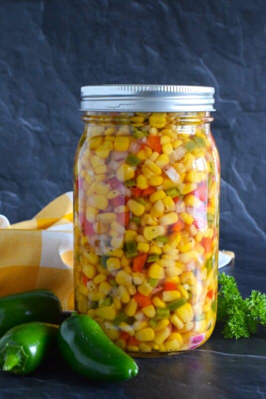 In most cases, corn relish recipes mean breaking out a pressure canner to preserve your bounty, but in the case of this Jalapeno Corn Relish, it's all about quick, easy, and now! This recipe prepares just one jar that you can keep safely in your fridge for up to two weeks! #jalapeno #pickle #corn #relish #sweet