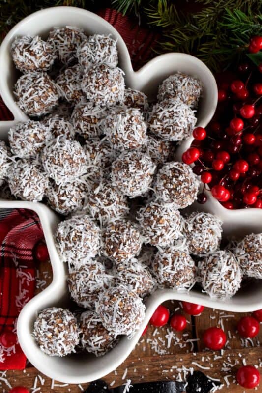 One of the most recognized confections in Newfoundland, these traditional snowballs are a no-bake version with lots of chocolate and coconut flavour! These delicious treats show up in almost every household at Christmastime, but in our home, they were eaten and enjoyed throughout the year! #nobake #snowballs #newfoundland #traditional #christmas