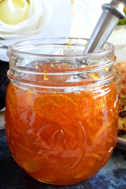 Perfectly tart and sweet Orange Marmalade Preserves is made without any thickening additives - great at breakfast time or over vanilla ice cream! Once you taste this homemade marmalade, you'll never buy it from the store again! #jam #marmalade #orange #preserves