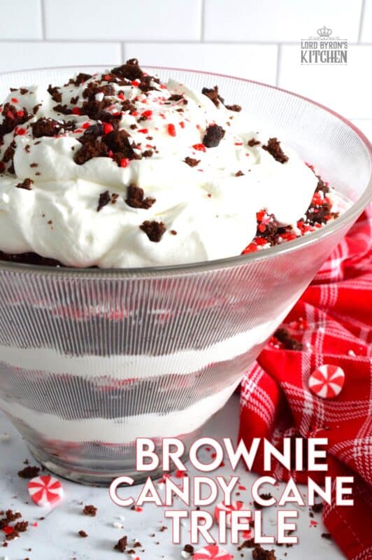 Prepared with two-bite brownies, decadent whipped cream, and crushed candy canes, this Brownie Candy Cane Trifle has all the flavours one craves at Christmastime! Take the easy route and purchase brownies at the grocer. Christmas no-bake desserts should be stress-free and relaxing after all! #peppermint #trifle #brownies #candycane