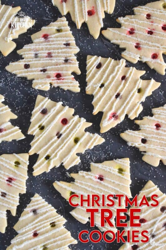 Dig out your tree-shaped cookie cutter and whip up a batch of these Christmas Tree Cookies! The ornaments are easy to make with crushed candy and they're baked right into the cookie dough. It's like adding decoration and flavour at the same time! #christmas #cookies #tree
