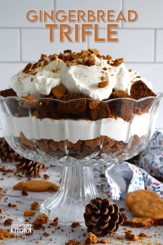 Homemade gingerbread cake makes up the bulk of this Gingerbread Trifle. Layered with fluffy whipped cream, crushed gingersnap cookies, and candied sugary ginger, this dessert is the perfect warm and cozy finish to a family holiday meal! #gingerbread #trifle #ginger #nobake