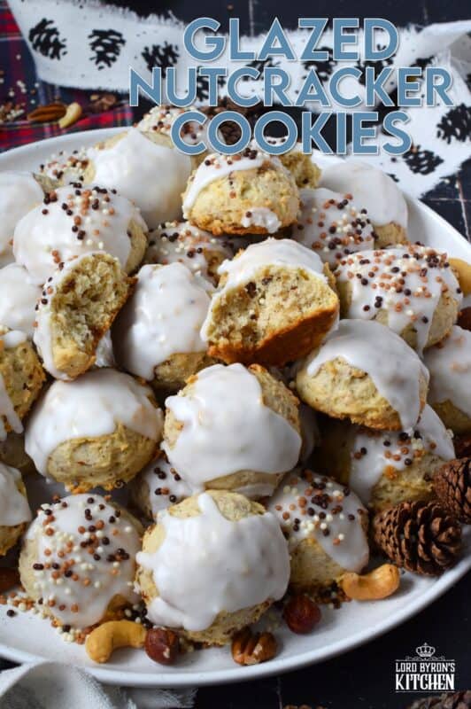 Alert the Mouse King because these Glazed Nutcracker Cookies are prepared with a copious amount of chopped nuts! Using salted nuts balances out the sweetness of the delicate, soft cookie and provides ample crunch and texture. Make extra and share them with your friends - just don't snack on them at the ballet! #nutcracker #christmas #cookies #glazed #nuts #nutty
