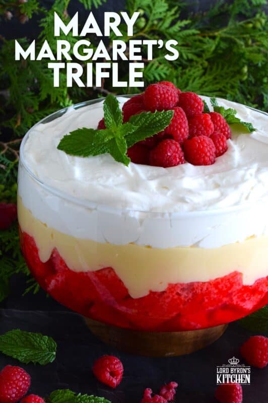 Mary Margaret's Trifle is a simple, rustic, uncomplicated dessert comprised of three layers. Starting with a pound cake layer where the cake is soaked in raspberry jello, followed by a thick layer of custard and topped with freshly prepared whipped cream. #trifle #vintage #retro #raspberry #jello #custard