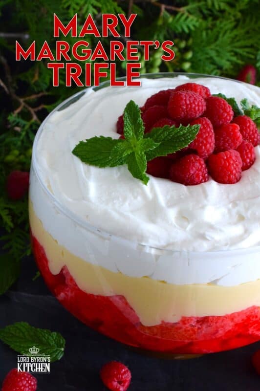 Mary Margaret's Trifle is a simple, rustic, uncomplicated dessert comprised of three layers. Starting with a pound cake layer where the cake is soaked in raspberry jello, followed by a thick layer of custard and topped with freshly prepared whipped cream. #trifle #vintage #retro #raspberry #jello #custard