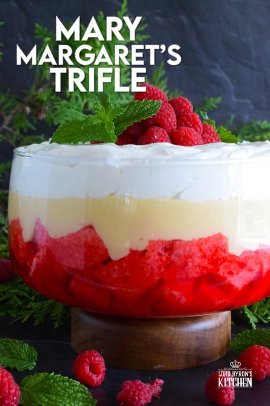 Mary Margaret's Trifle is a simple, rustic, uncomplicated dessert comprised of three layers. Starting with a pound cake layer where the cake is soaked in raspberry jello, followed by a thick layer of custard and topped with freshly prepared whipped cream. #trifle #vintage #retro #raspberry #jello #custard