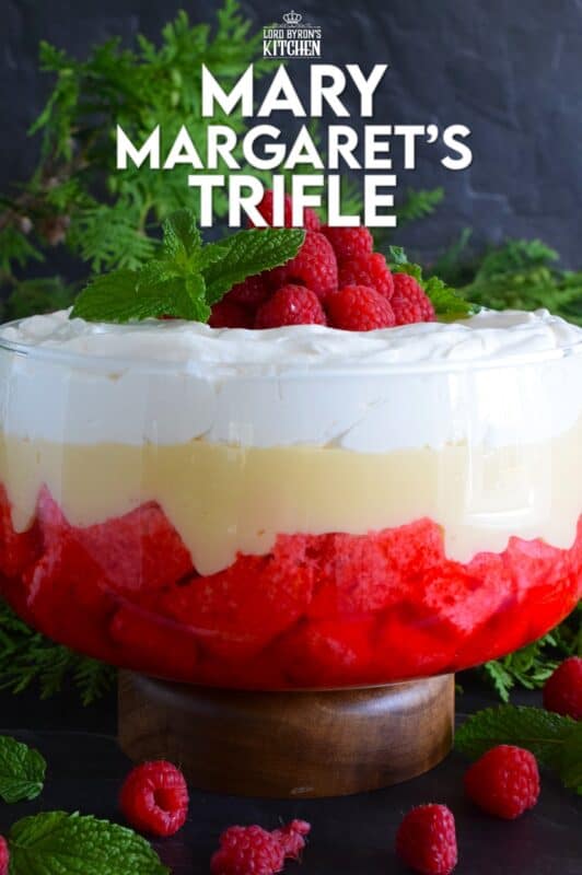 Mary Margaret's Trifle is a simple, rustic, uncomplicated dessert comprised of three layers. Starting with a pound cake layer where the cake is soaked in raspberry jello, followed by a thick layer of custard and topped with freshly prepared whipped cream. #trifle #vintage #retro #raspberry #jello #custard