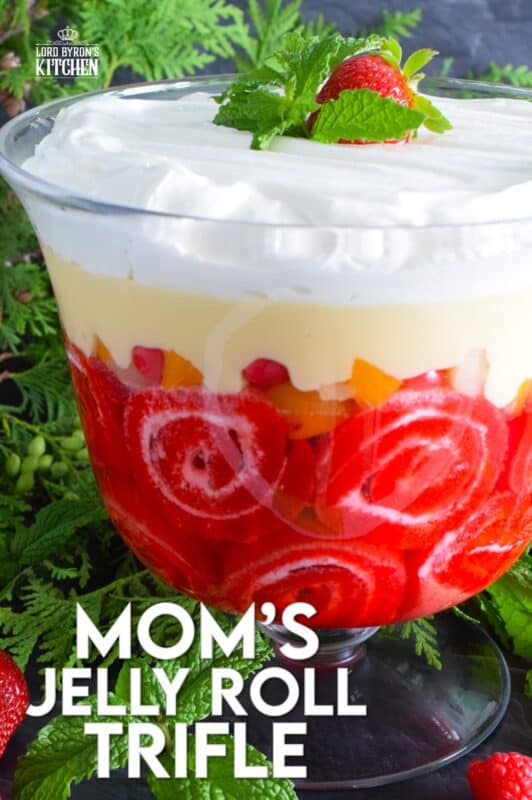 Mom's Jelly Roll Trifle starts with a store-bought raspberry jelly roll that is sliced and layered with raspberry jello, custard, fruit cocktail, and dream whip. This uncomplicated dessert, with its humble beginnings, is how I remember my mom's deliciously satisfying Sunday trifle. #trifle #cocktail #jellyroll #dessert