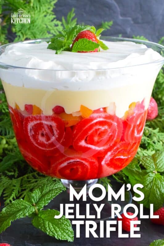 Mom's Jelly Roll Trifle starts with a store-bought raspberry jelly roll that is sliced and layered with raspberry jello, custard, fruit cocktail, and dream whip. This uncomplicated dessert, with its humble beginnings, is how I remember my mom's deliciously satisfying Sunday trifle. #trifle #cocktail #jellyroll #dessert