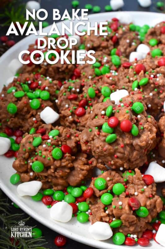 Time is short at Christmas with so many things to do, so incorporate some no-bake cookie options into your holiday baking to make your life easier. No Bake Avalanche Drop Cookies are prepared with chocolate, peanut butter, marshmallows, cereal, and candy. They are quick, easy, budget-friendly, and of course, delicious! #nobake #peanutbutter #drop #cookies #mm #christmas
