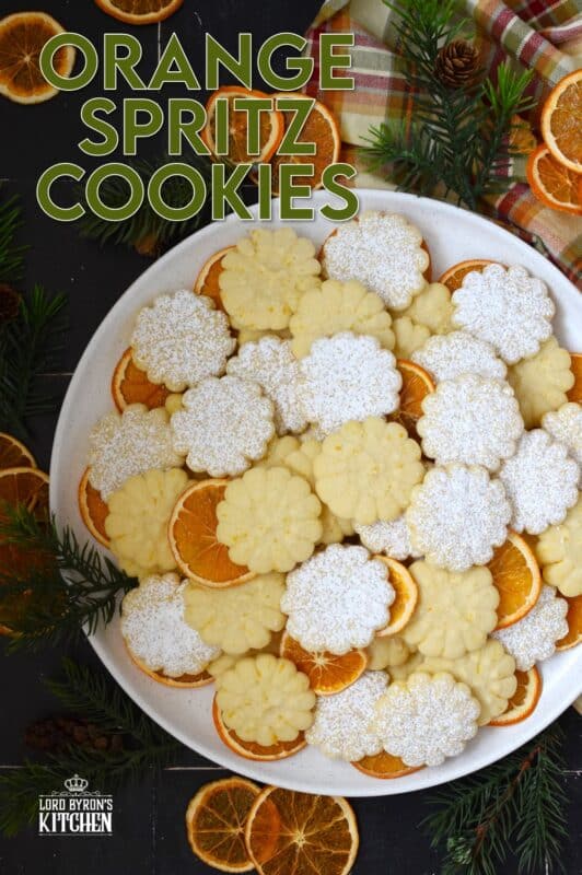 Slightly sweet and buttery with a burst of fresh citrus flavour, these Orange Spritz Cookies melt in your mouth! Every holiday cookie exchange or plate must have a spritz cookie, so I encourage you to try this classic recipe with an orange zest twist! #spritz #cookies #orange #zest