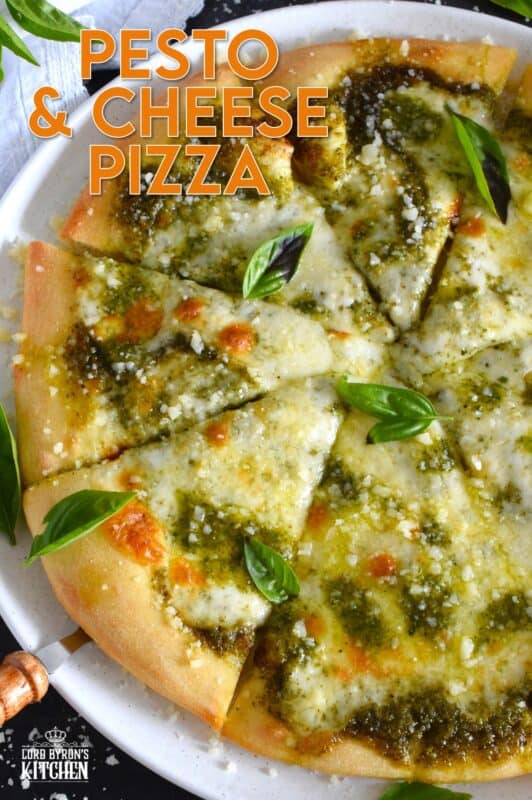 There is no steadfast rule that states pizza must be prepared with tomato sauce and the proof can be found right here in this Pesto and Cheese Pizza recipe! Start with a quick and easy homemade pesto sauce and a very simple pizza dough - you can use store-bought pesto and dough too! Either way, this pizza is bound to impress! #pizza #pesto #basil #vegetarian #cheese