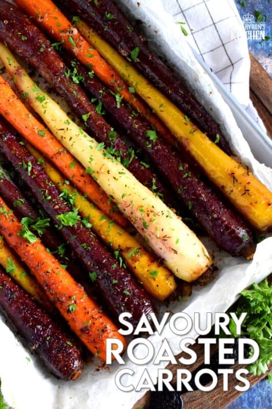 A wonderful, earthy side dish, Savoury Roasted Carrots combines dried pantry herbs with olive oil to make a home-style, rustic - and colourful! - side dish. Surprisingly simple, yet extremely delicious, this is one of my most popular holiday recipes! #carrots #roasted #heirloom
