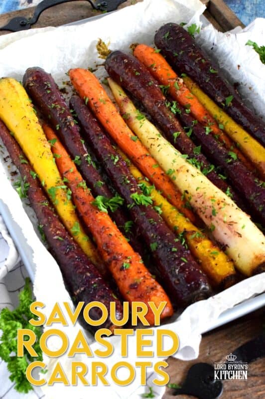 A wonderful, earthy side dish, Savoury Roasted Carrots combines dried pantry herbs with olive oil to make a home-style, rustic - and colourful! - side dish. Surprisingly simple, yet extremely delicious, this is one of my most popular holiday recipes! #carrots #roasted #heirloom