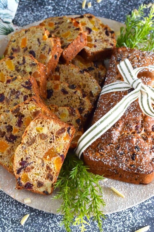 Traditionally prepared stollen, depending on the recipe and method, can take more than a day to prepare. This German Stollen-Inspired Bread makes use of the flavours associated with stollen but cuts back drastically on the time it usually takes. Steep the ingredients with rum or make it alcohol-free with apple juice instead. #stollen #christmas #bread #loaf #easy #inspired #german