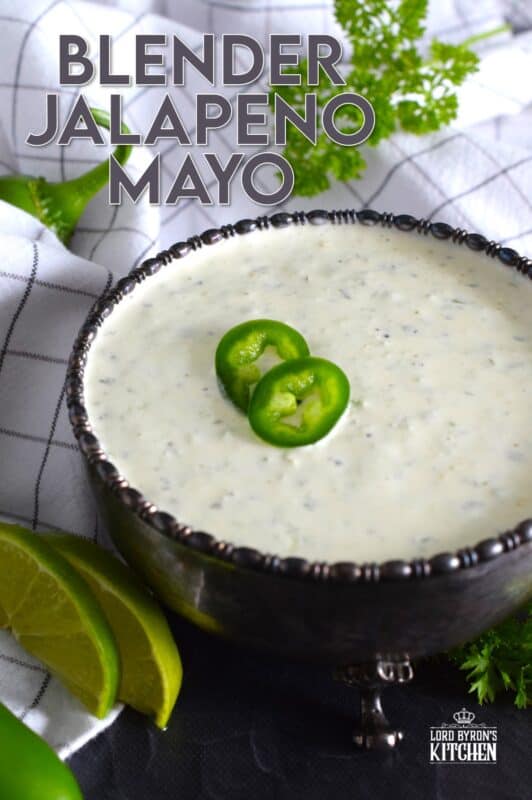 This spicy mayonnaise has just a few basic ingredients and takes about five minutes to prepare. Blender Jalapeno Mayo uses store-bought mayonnaise and combines it with fresh jalapenos, ground black pepper, parsley, garlic, onion, and lime juice. It's a spread, it's a dip, and it's a sauce! #sauce #mayo #jalapeno #spicy