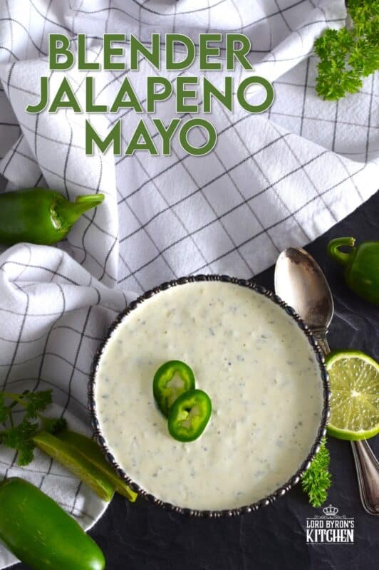 This spicy mayonnaise has just a few basic ingredients and takes about five minutes to prepare. Blender Jalapeno Mayo uses store-bought mayonnaise and combines it with fresh jalapenos, ground black pepper, parsley, garlic, onion, and lime juice. It's a spread, it's a dip, and it's a sauce! #sauce #mayo #jalapeno #spicy