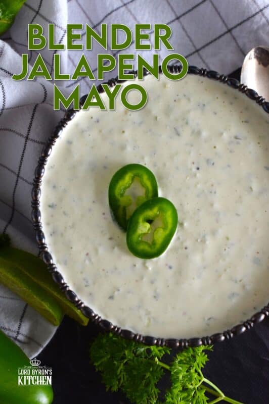 This spicy mayonnaise has just a few basic ingredients and takes about five minutes to prepare. Blender Jalapeno Mayo uses store-bought mayonnaise and combines it with fresh jalapenos, ground black pepper, parsley, garlic, onion, and lime juice. It's a spread, it's a dip, and it's a sauce! #sauce #mayo #jalapeno #spicy