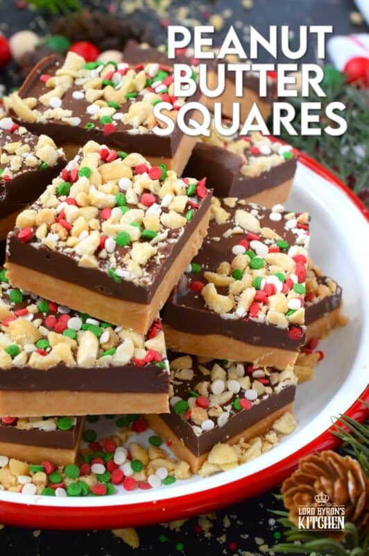 Peanut Butter Squares are a twist on the classic Peanut Butter Ball recipe. These are less time-consuming for sure but are prepared with the smooth peanut butter lover in mind. It's the same great taste but without the crunch of the rice cereal! Christmas cookie boxes are nothing without these delicious confections! #peanutbutter #christmas #squares #nobake