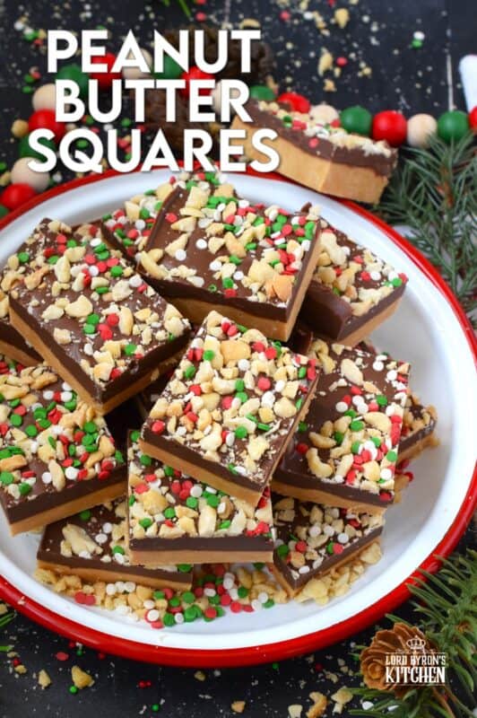 Peanut Butter Squares are a twist on the classic Peanut Butter Ball recipe. These are less time-consuming for sure but are prepared with the smooth peanut butter lover in mind. It's the same great taste but without the crunch of the rice cereal! Christmas cookie boxes are nothing without these delicious confections! #peanutbutter #christmas #squares #nobake