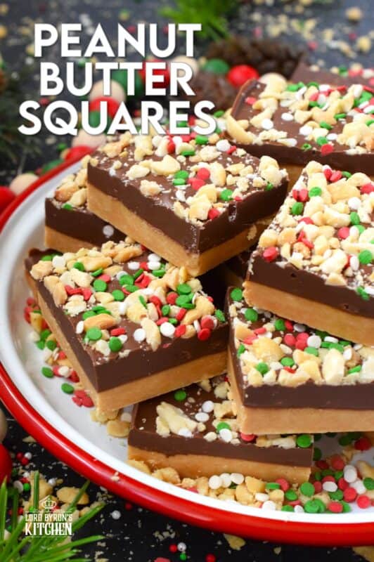 Peanut Butter Squares are a twist on the classic Peanut Butter Ball recipe. These are less time-consuming for sure but are prepared with the smooth peanut butter lover in mind. It's the same great taste but without the crunch of the rice cereal! Christmas cookie boxes are nothing without these delicious confections! #peanutbutter #christmas #squares #nobake
