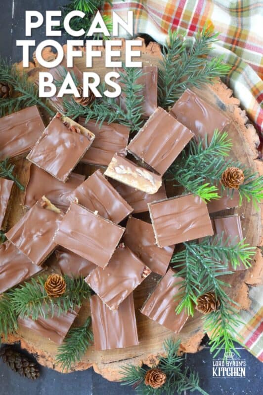 Loaded with toasted pecans, these Pecan Toffee Bars have a shortbread crumb base and a caramel, pecan center. Topped with melted milk chocolate, these bars are just heavenly! This is a holiday confection that will be difficult to share and part with. Maybe it's a good idea to make a double batch of these after all! #toffee #pecan #squares #bars