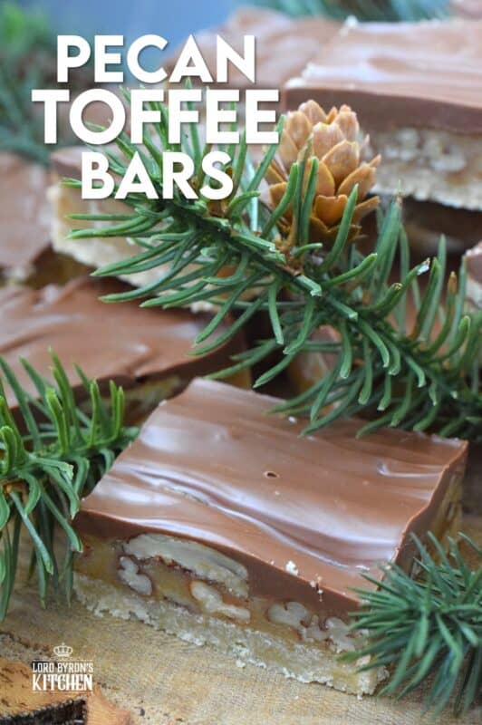 Loaded with toasted pecans, these Pecan Toffee Bars have a shortbread crumb base and a caramel, pecan center. Topped with melted milk chocolate, these bars are just heavenly! This is a holiday confection that will be difficult to share and part with. Maybe it's a good idea to make a double batch of these after all! #toffee #pecan #squares #bars