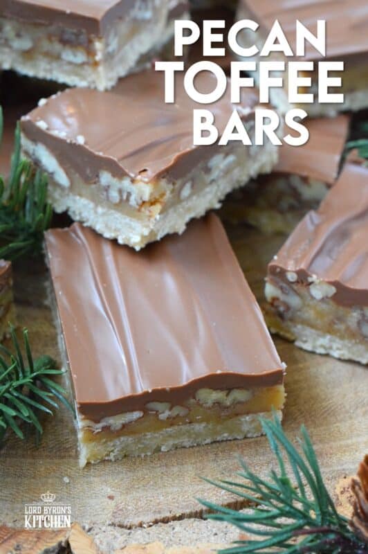 Loaded with toasted pecans, these Pecan Toffee Bars have a shortbread crumb base and a caramel, pecan center. Topped with melted milk chocolate, these bars are just heavenly! This is a holiday confection that will be difficult to share and part with. Maybe it's a good idea to make a double batch of these after all! #toffee #pecan #squares #bars