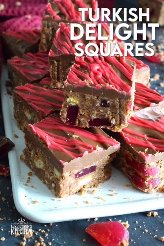 Prepared with Turkish Delight Chocolate Bars, these squares are flavoured with the familiar combination of rosewater, bergamot, and cinnamon. The chopped jellied candy is paired with condensed milk, coconut, crushed biscuits, and melted white chocolate. Turkish Delight Squares are extraordinarily delicious! #turkish #delight #rosewater #bergamot #nobake