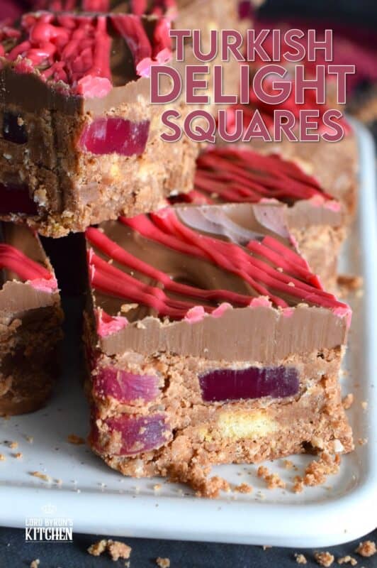 Prepared with Turkish Delight Chocolate Bars, these squares are flavoured with the familiar combination of rosewater, bergamot, and cinnamon. The chopped jellied candy is paired with condensed milk, coconut, crushed biscuits, and melted white chocolate. Turkish Delight Squares are extraordinarily delicious! #turkish #delight #rosewater #bergamot #nobake