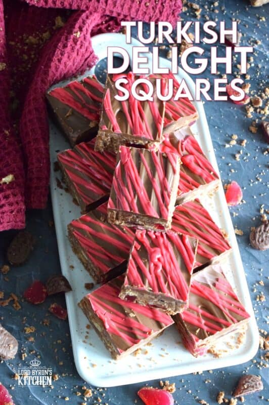 Prepared with Turkish Delight Chocolate Bars, these squares are flavoured with the familiar combination of rosewater, bergamot, and cinnamon. The chopped jellied candy is paired with condensed milk, coconut, crushed biscuits, and melted white chocolate. Turkish Delight Squares are extraordinarily delicious! #turkish #delight #rosewater #bergamot #nobake