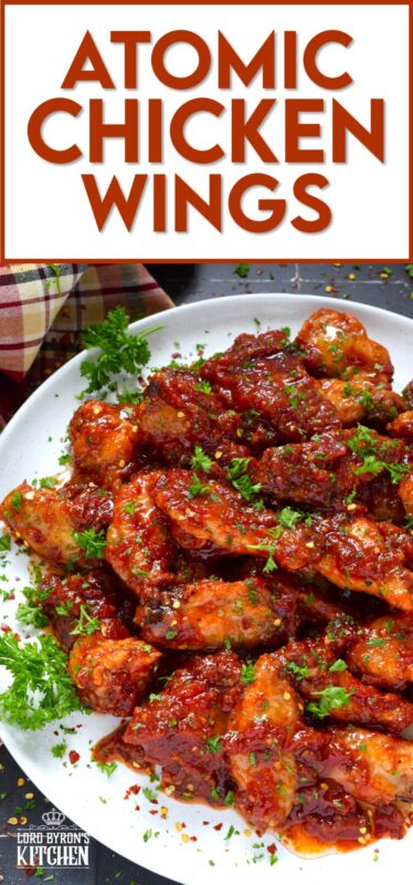 If wings dripping with a spicy and savoury sauce are what you're looking for, you've found them! Atomic Chicken Wings are baked until crispy and then tossed in a homemade sweet and spicy sauce made with crushed tomatoes, hot sauce, brown sugar, and lots of aromatic seasonings. You've never eaten wings this good! #chicken #wings #saucy #atomic #spicy #sweet #copycat #wingstop