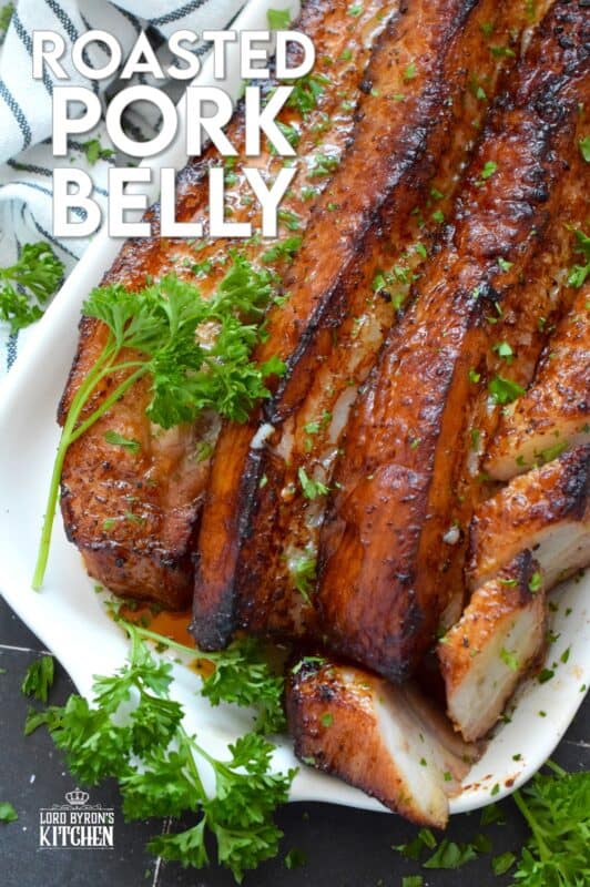 Roasted in a very hot oven, the thick skin on a slice of pork belly will develop a similar crispy and crunchy texture to that of chicharrones. Marinated and flavoured with simple seasonings and sauces found in most kitchens, this Roasted Pork Belly is baked until moist and tender, making this main easy to prepare and a delight to eat! #porkbelly #chicharrones #pork 