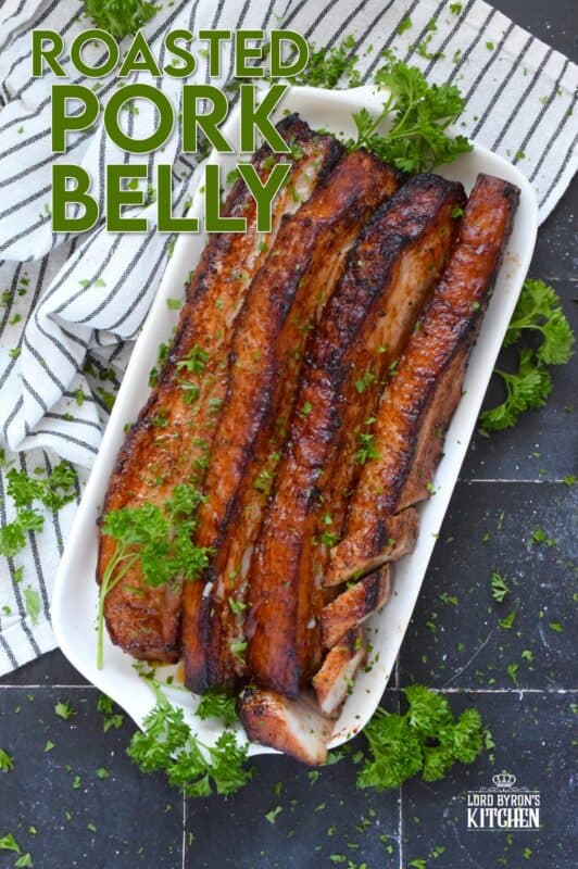 Roasted in a very hot oven, the thick skin on a slice of pork belly will develop a similar crispy and crunchy texture to that of chicharrones. Marinated and flavoured with simple seasonings and sauces found in most kitchens, this Roasted Pork Belly is baked until moist and tender, making this main easy to prepare and a delight to eat! #porkbelly #chicharrones #pork 