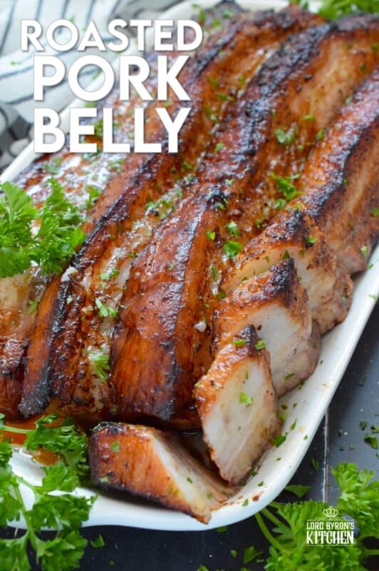 Roasted in a very hot oven, the thick skin on a slice of pork belly will develop a similar crispy and crunchy texture to that of chicharrones. Marinated and flavoured with simple seasonings and sauces found in most kitchens, this Roasted Pork Belly is baked until moist and tender, making this main easy to prepare and a delight to eat! #porkbelly #chicharrones #pork 