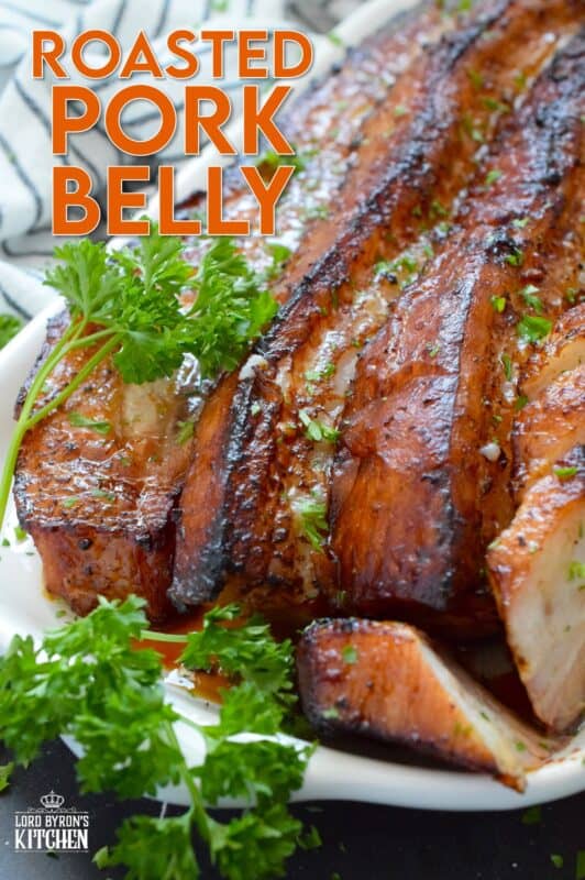 Roasted in a very hot oven, the thick skin on a slice of pork belly will develop a similar crispy and crunchy texture to that of chicharrones. Marinated and flavoured with simple seasonings and sauces found in most kitchens, this Roasted Pork Belly is baked until moist and tender, making this main easy to prepare and a delight to eat! #porkbelly #chicharrones #pork 