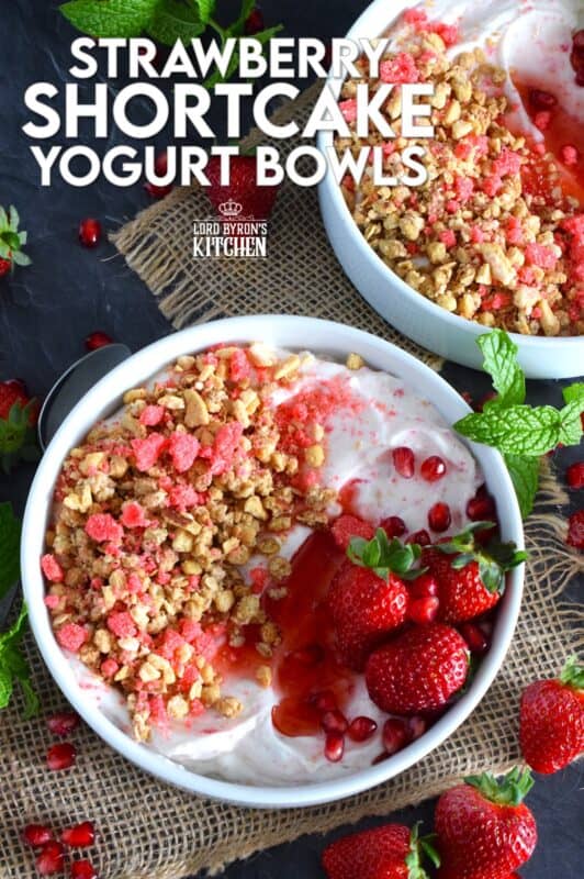 Strawberry shortcake crumbs are stirred into Greek yogurt and then topped with fresh strawberries, more shortcake crumbs, a drizzle of homemade quick and easy strawberry syrup, and a little granola for added crunch and flavour. Strawberry Shortcake Yogurt Bowls make a great summer Sunday brunch menu option! #strawberry #shortcake #crumbs #yogurt #bowls #brunch #summer