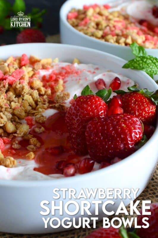 Strawberry shortcake crumbs are stirred into Greek yogurt and then topped with fresh strawberries, more shortcake crumbs, a drizzle of homemade quick and easy strawberry syrup, and a little granola for added crunch and flavour. Strawberry Shortcake Yogurt Bowls make a great summer Sunday brunch menu option! #strawberry #shortcake #crumbs #yogurt #bowls #brunch #summer